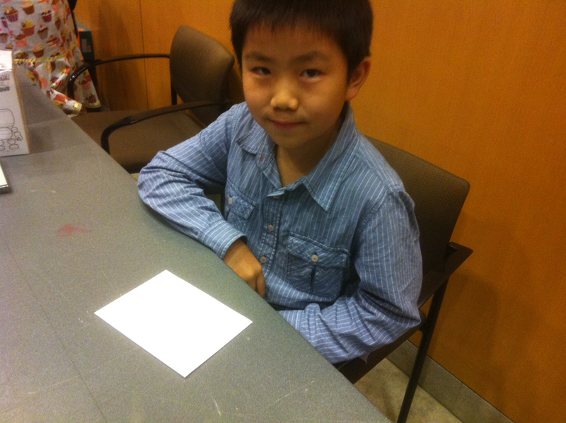 Perry Chen sitting at a table