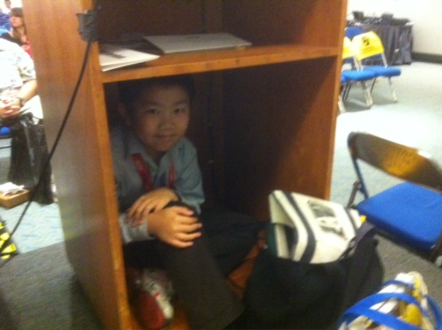 Perry Chen hiding in the back of a podium