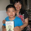 Perry Chen in the arms of his mother Zhu Shen